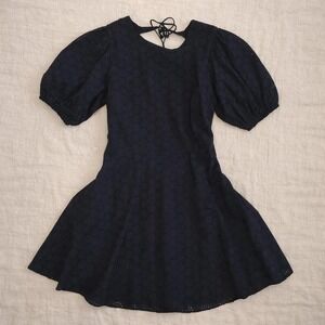 Olivaceous black lace dress with tie back detail. Size M